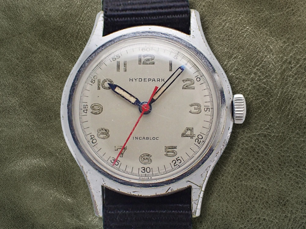 ハイドパーク ミリタリースタイル 50年代 スイス製 17石 メッキ/SS シルバーダイヤル 引き通しストラップ装着 HYDEPARK WATCH CO [代行おまかせコース]