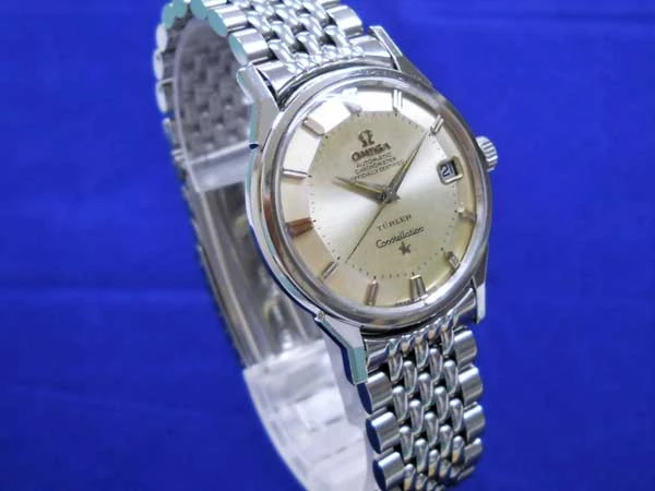 オメガ コンステレーション Omega Constellation クロノメーター Cal.561 人気12角ダイアル TURLER Wネーム 7連ブレスレット仕様