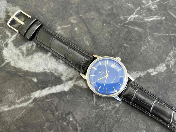 オメガ OMEGA ジュネーブ ブルー文字盤 136.011SP Cal.613 日産建設 勤続25年表彰 透かしΩマーク風防