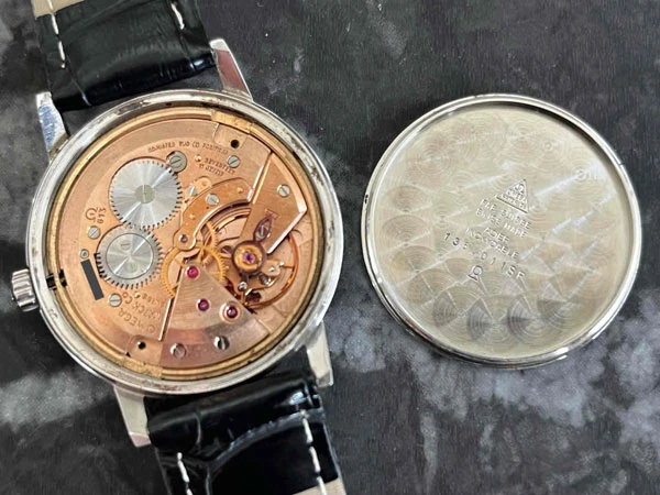 オメガ OMEGA ジュネーブ ブルー文字盤 136.011SP Cal.613 日産建設 勤続25年表彰 透かしΩマーク風防